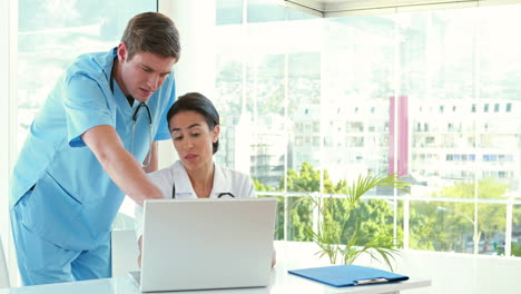 doctors working on laptop computer