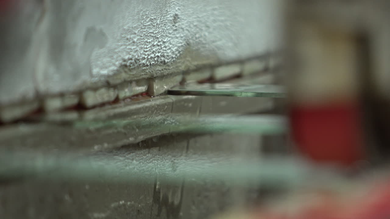 Industry machine for smoothing edges of a glass panel