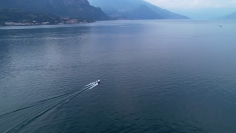 aerial view of speedboat going across lake como