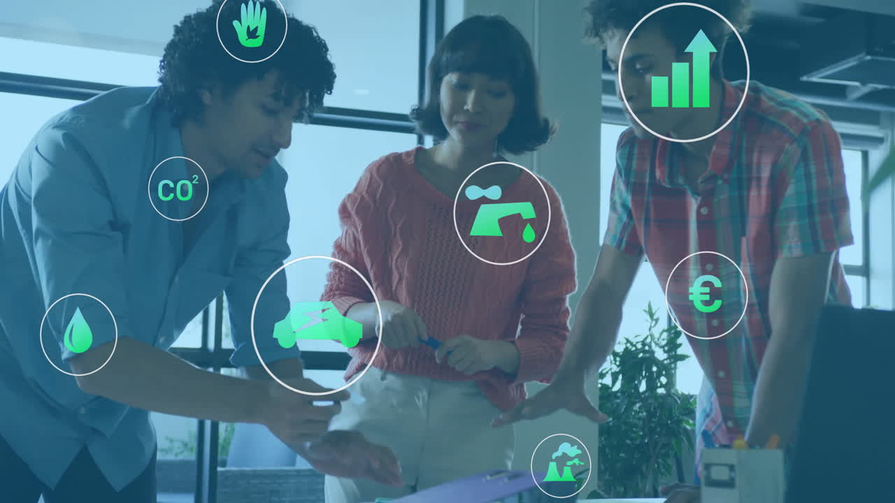 Animation of ecology icons over diverse colleagues talking in office