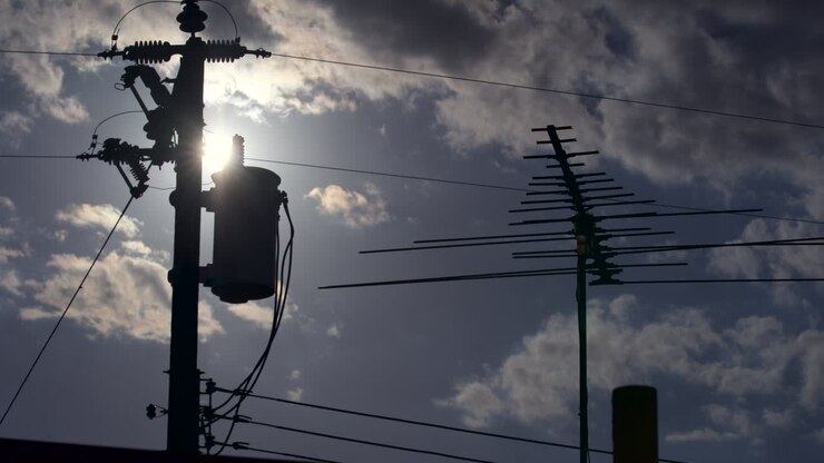 Time Lapse of Sun Going Down Behind Roof Antennas and Power Lines
