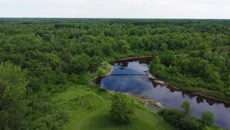 moving away from swinging wooden bridge deep in forest