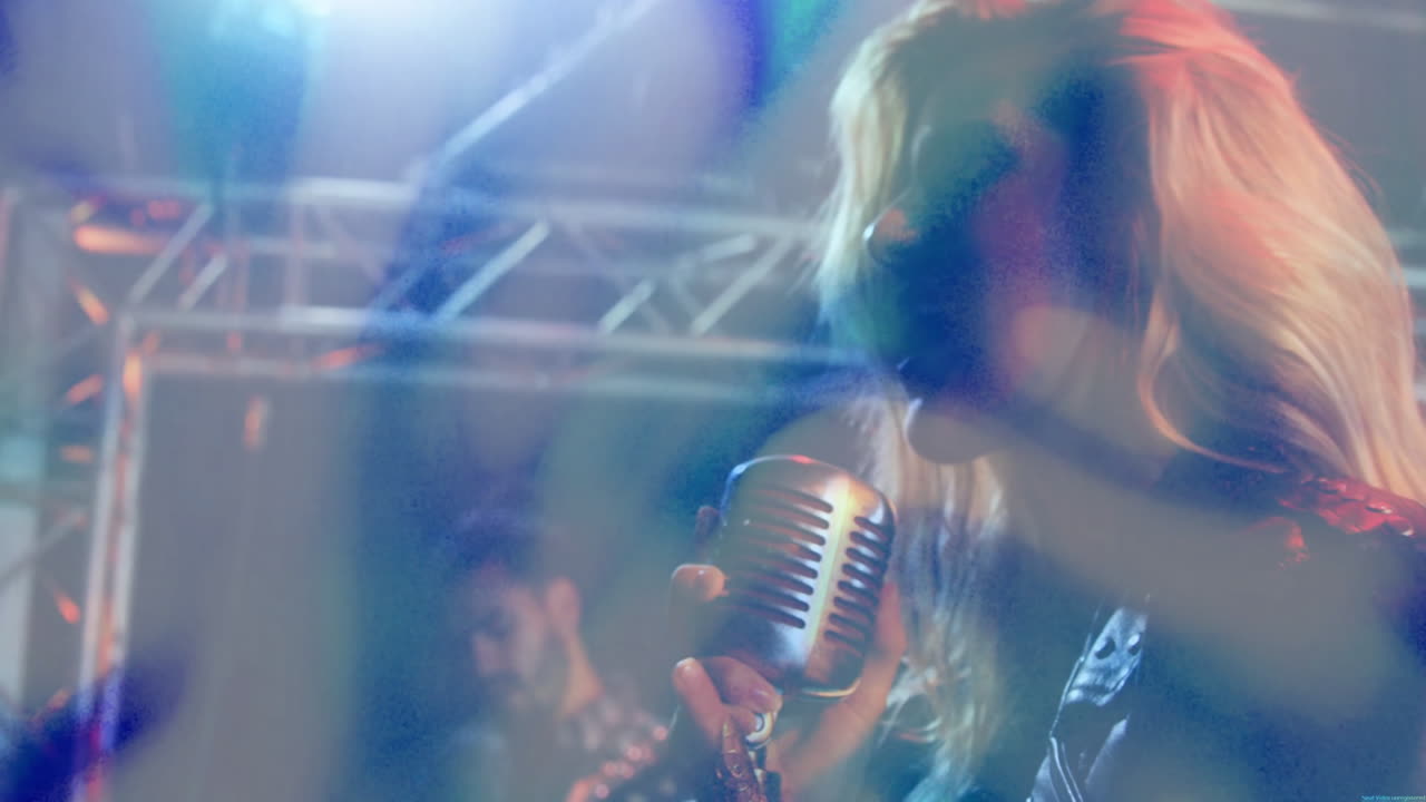 Female singer performing on music industry stage, with animated equalizer bars and light flares