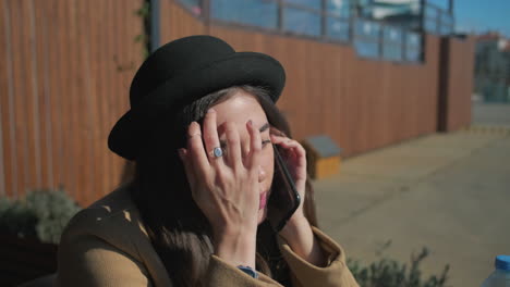 woman talking on phone outdoors