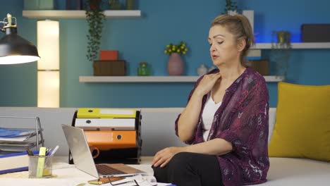 Home-office-worker-woman-loosening-her-tie-from-stress.