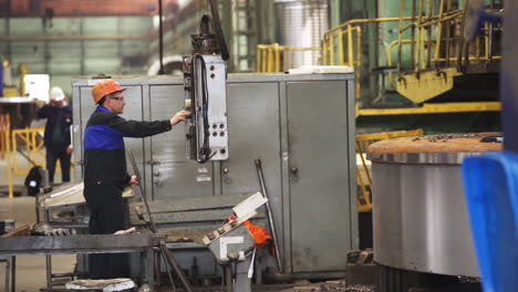 factory worker operating machinery