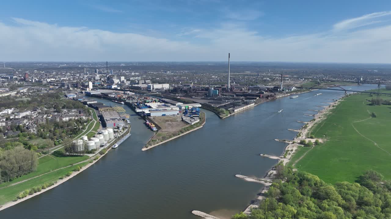 Rhine river, industrial ruhr region, shipping waterway for industrial transport. Infrastructure, Trade and industry in Germany. Aerial view.