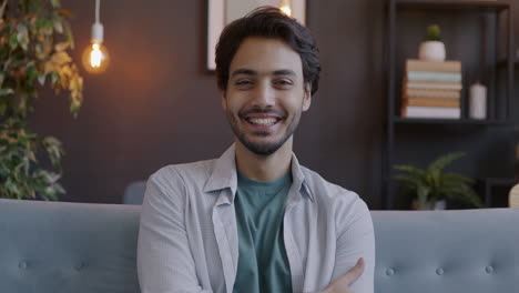 happy man sitting on sofa
