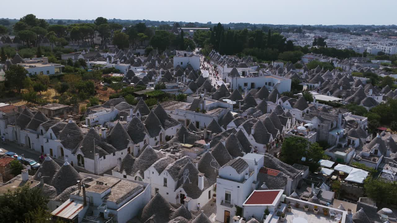 Aerial view over historic Alberobello. Shows dense cluster of unique trulli houses with conical stone roofs. UNESCO World Heritage site. For travel or documentary use, Puglia, Italy