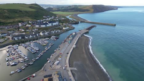 drone footage on a summer day in uk wales aberystwyth around the beach, harbour, sea side, clif and town front-17