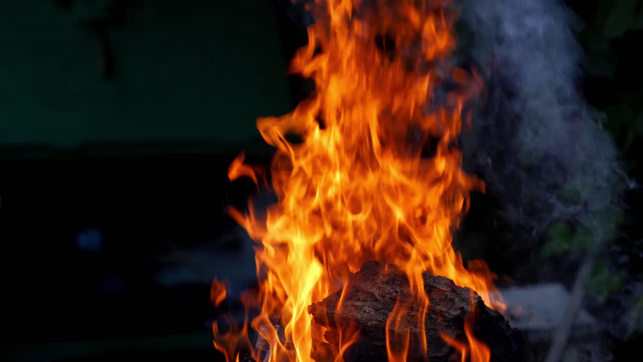 Bonfire burning at night. Burning logs in orange flames. Fire flame