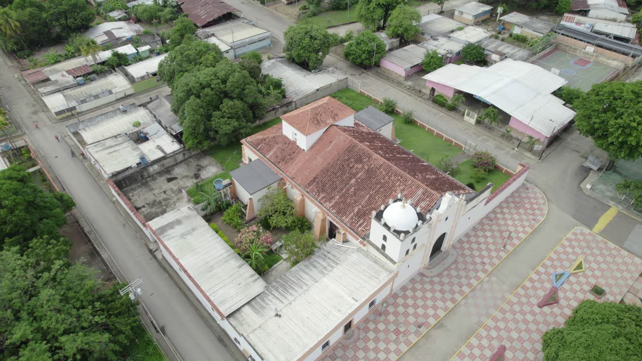 Aerial orbit around a historic church in Parapara, Guárico, Venezuela