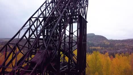 slomotion aerial upward pedestal of an abandoned mine headframe