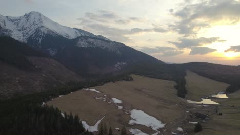 high tatras bird's eye view, sunset over the mountains, dolly out reveal