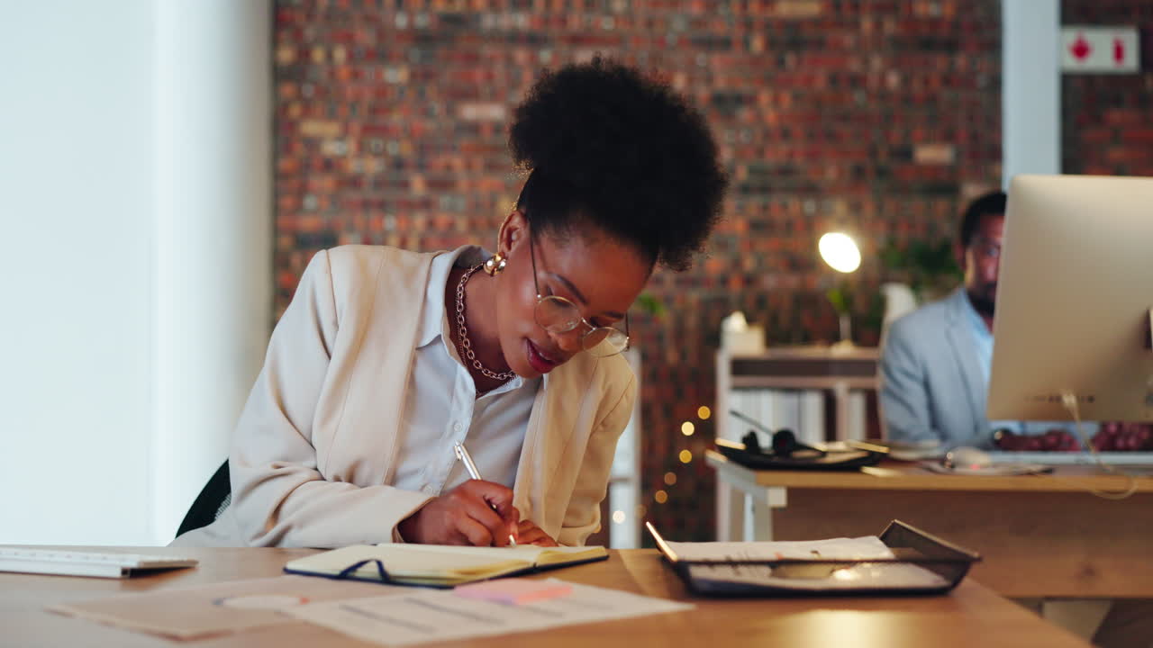 Business, black woman and writing notes