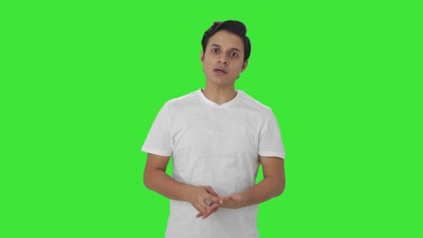 indian man talking to the camera green screen