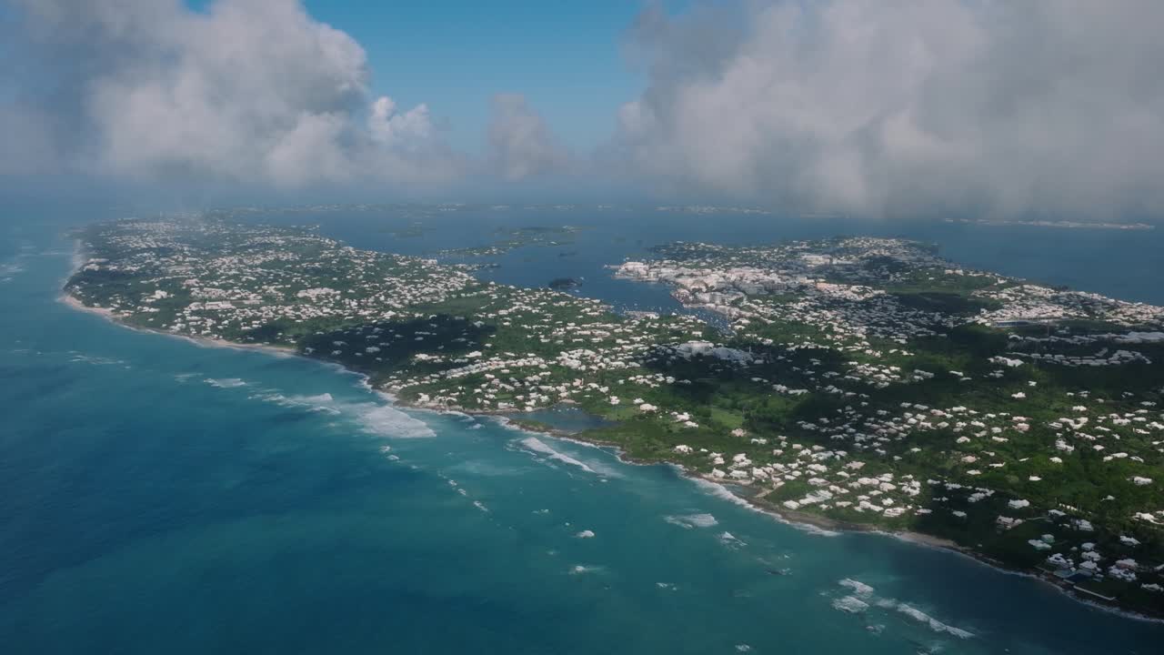 Aerial of the North Shore of Bermuda adorned with its unique colorful houses and whites roofs. video 6