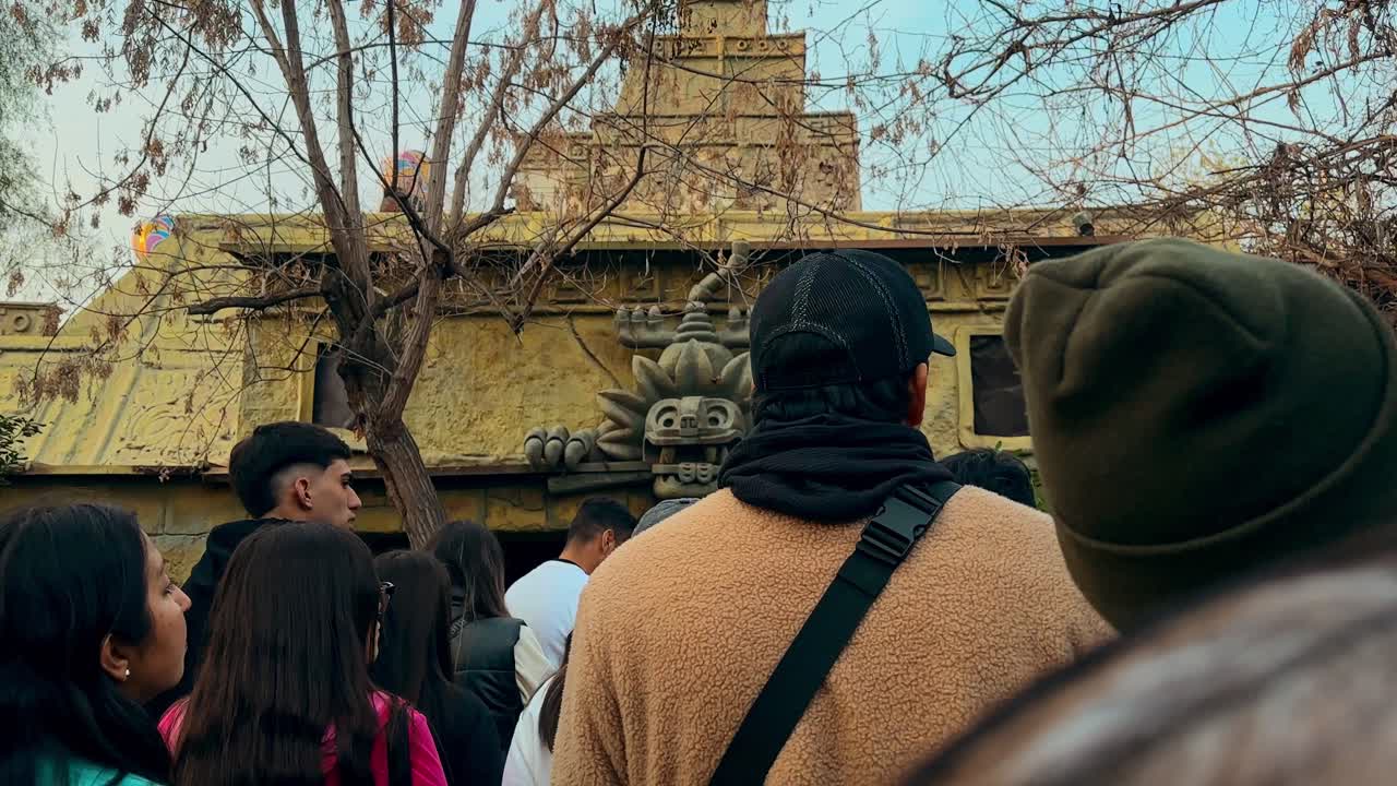 Group of people waiting to enter La Monga, a secret event at the Fantasilandia amusement park, Santiago, Chile.