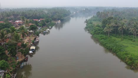 aerial view of a canal in a tropical village