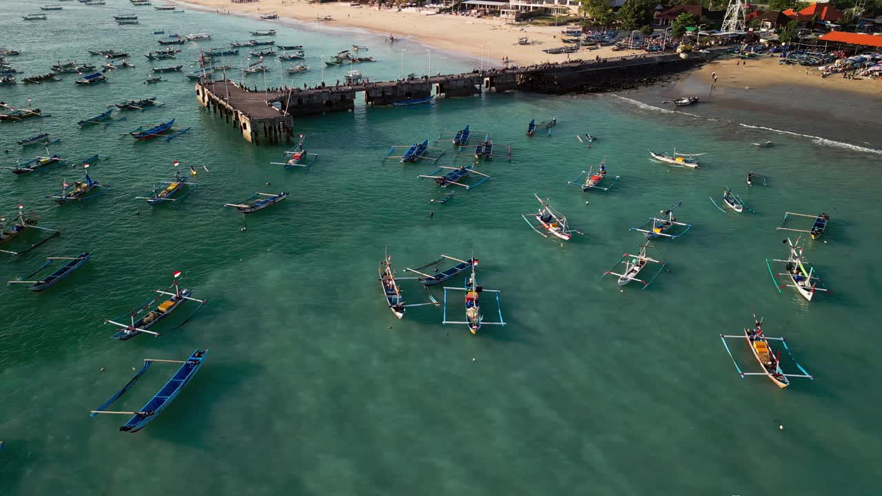 Coastal harbor in Bali where colorful fishing boats gather in turquoise sea, showing maritime heritage, tropical surroundings, and authentic island tradition with cultural seascape charm