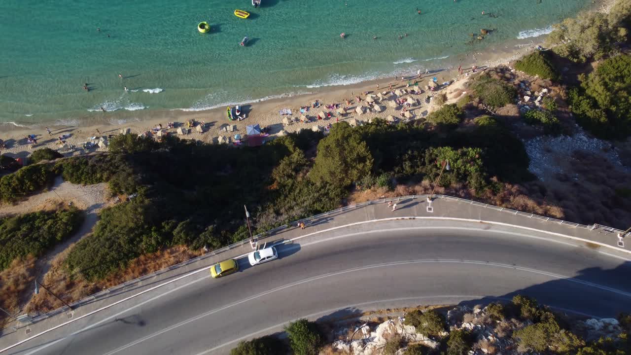 Aerial View of Coastal Road and Beach with Clear Blue Water