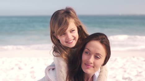 Young-smiling-mother-with-her-daughter