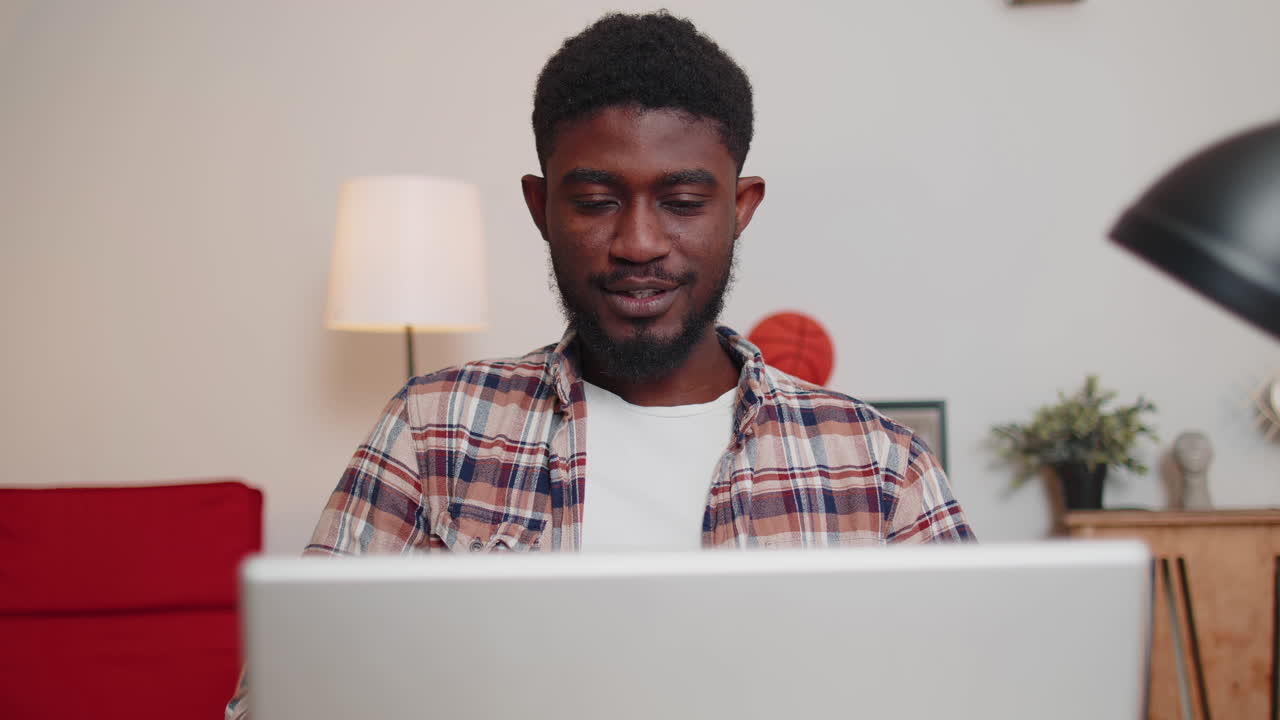 African american making conference calling by webcam, focused student study online at home office