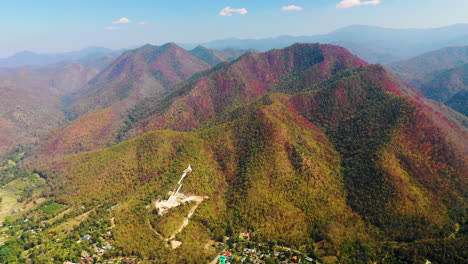 High-aerial-view-of-a-temple-in-the-picturesque-hills-of-Pai,-Thailand