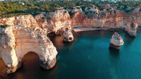 stunning coastal cliffs and turquoise waters of portugal's algarve region