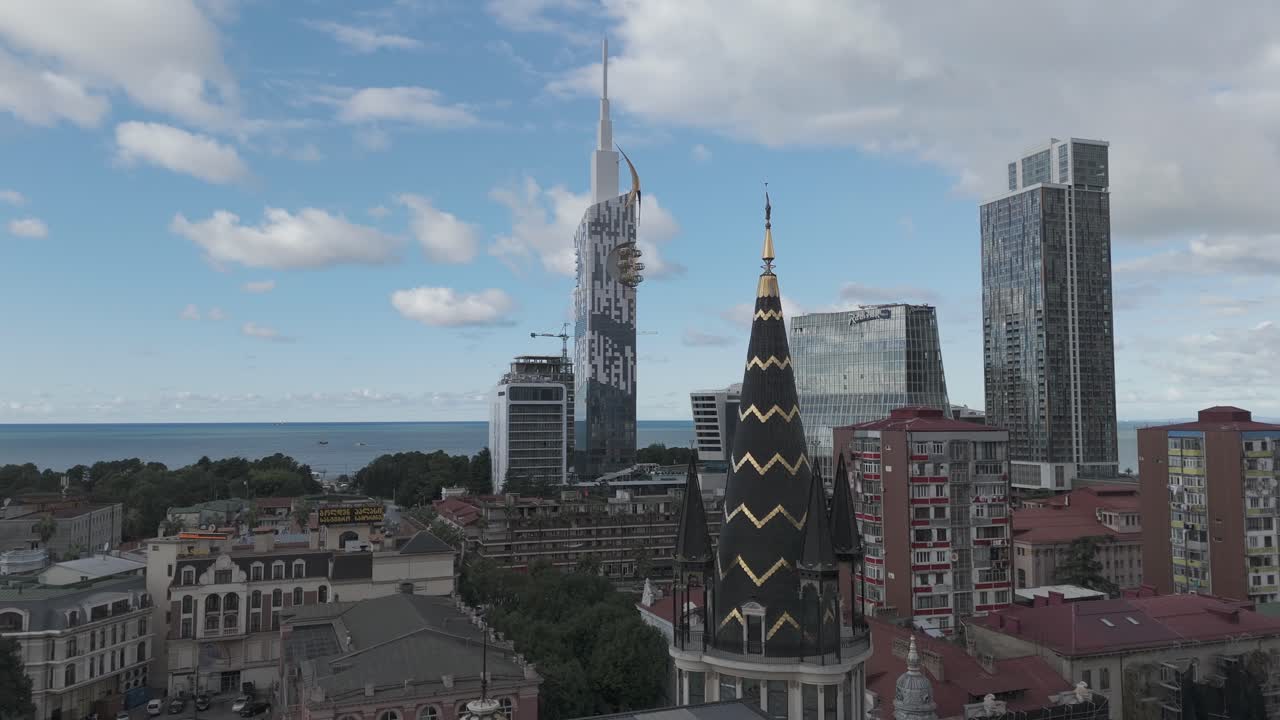 Cinematic daytime drone footage of Batumi skyline and skyscrapers.