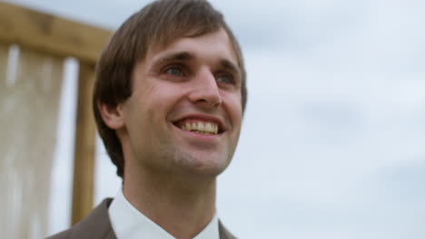 closeup of a happy groom