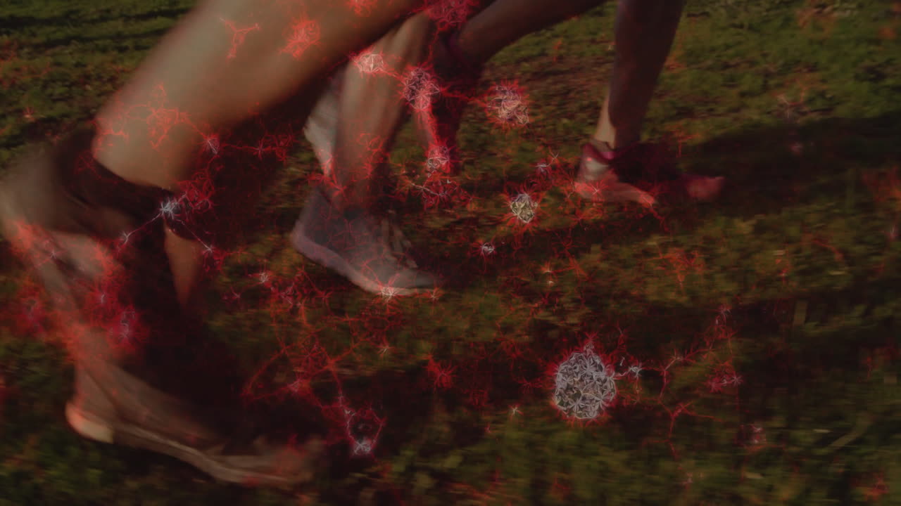 Running on grass, feet with red network animation overlay in dynamic motion
