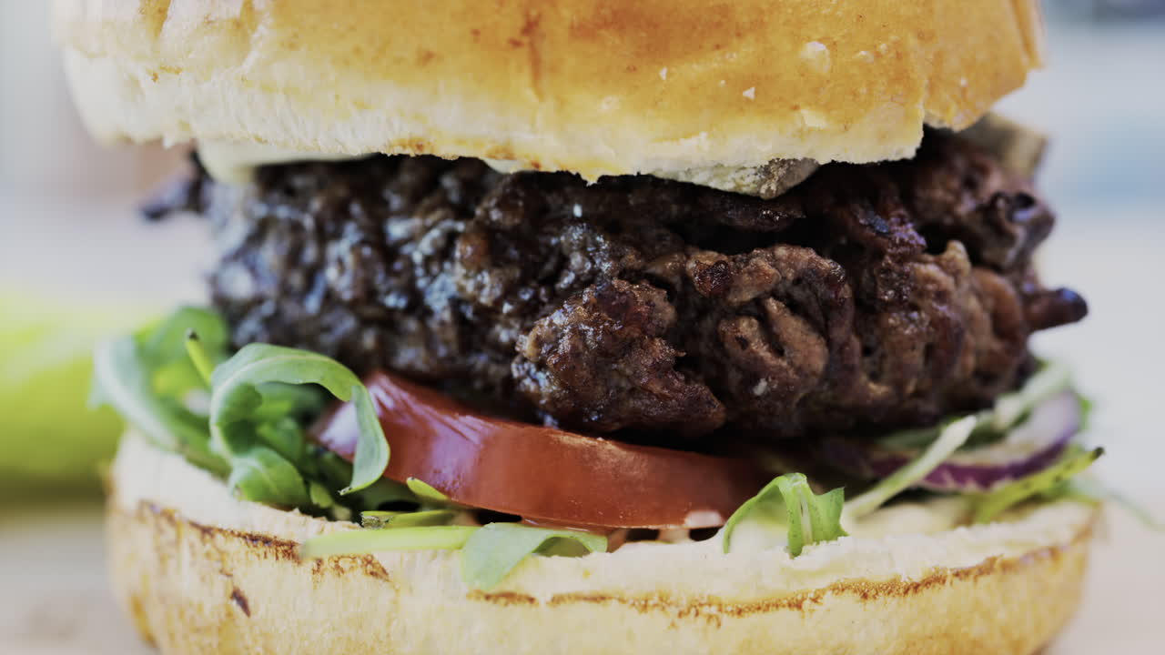 Close up of a hamburger on a plate at a restaurant