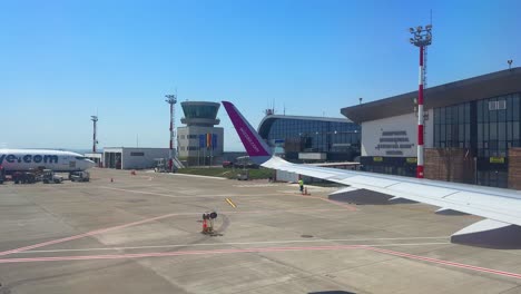 suceava airport wizz air plane airbus airplane tarmac window wing view