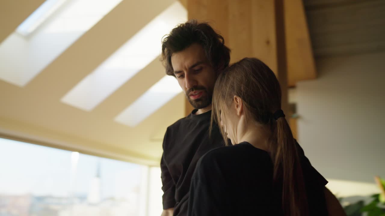 Couple embracing indoors
