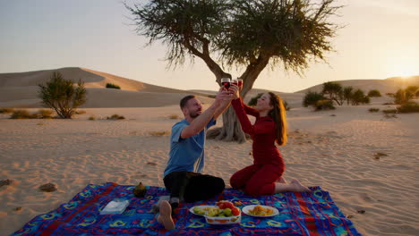 romantic picnic in the desert at sunset