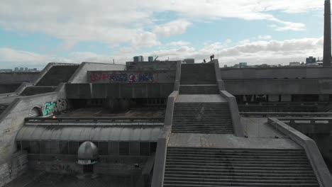 abandoned building rooftop with graffiti and cityscape view