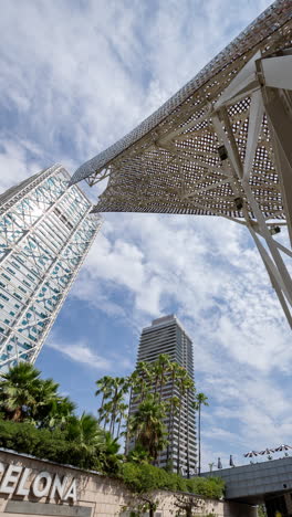 wide angle timelapse of skyscraper buildings in barcelona in vertical