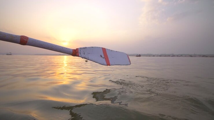 Slow Motion Oar Stroke at Sunset
