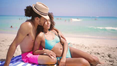 couple resting on beach