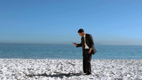 businessman throwing his mobile in the air