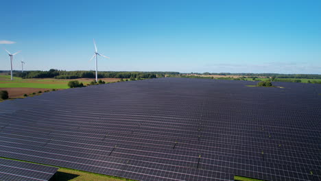 aerial view over large solar panel farm with