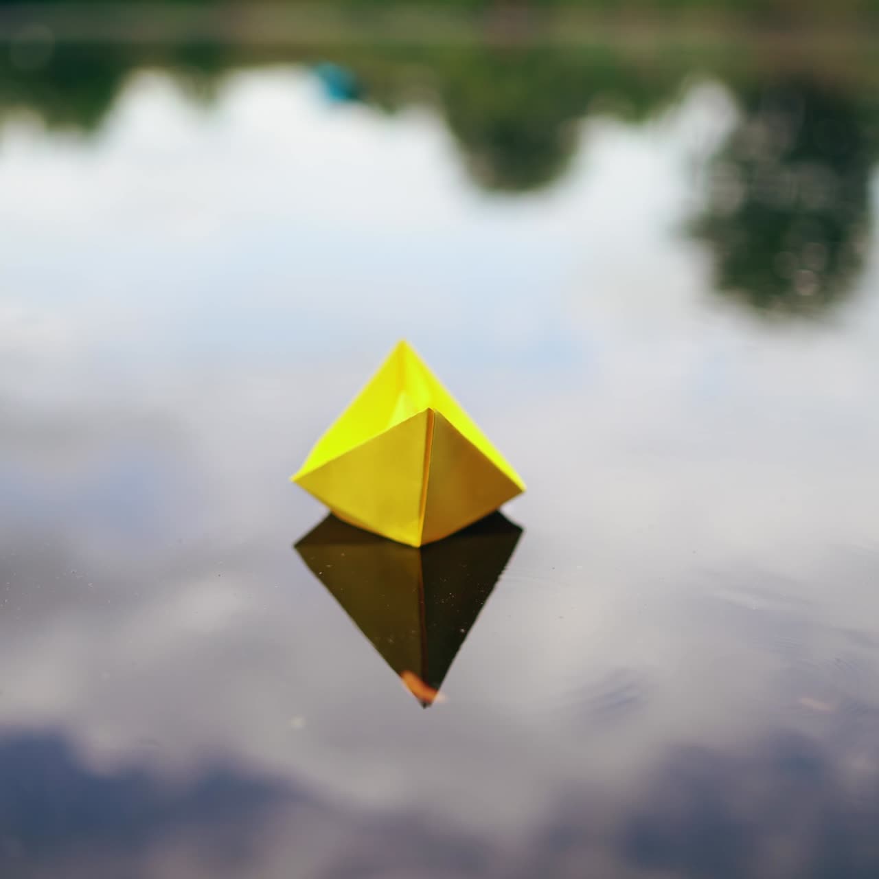 Paper ship in woman hand