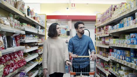 couple buying products in store