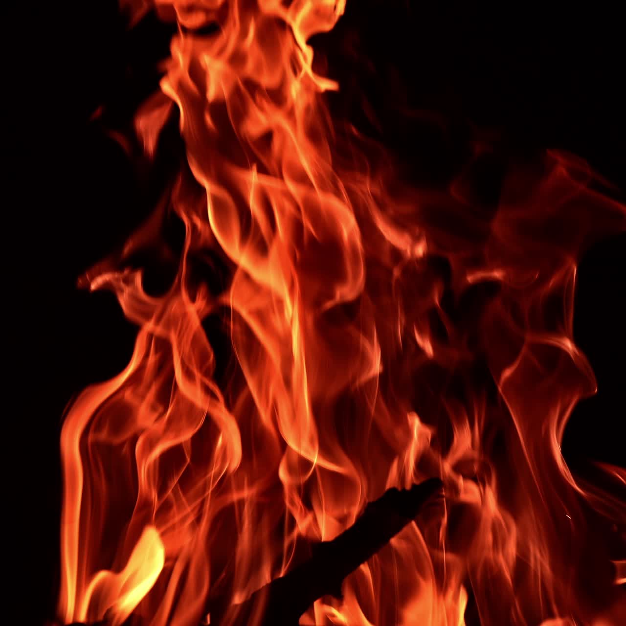 Bonfire flame heating in slow motion. Night fireplace glowing