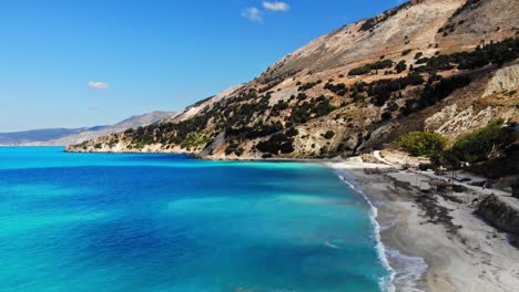 sandy beach of agia kiriaki with emerald clear sea in south milos island, cyclades, greece - aerial drone shot