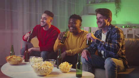 friends enjoying drinks and watching tv