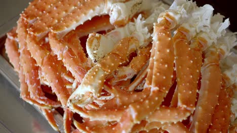 freshly cooked crab legs piled together, showcasing seafood texture