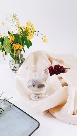 elegant dessert table setting with grapes and flowers