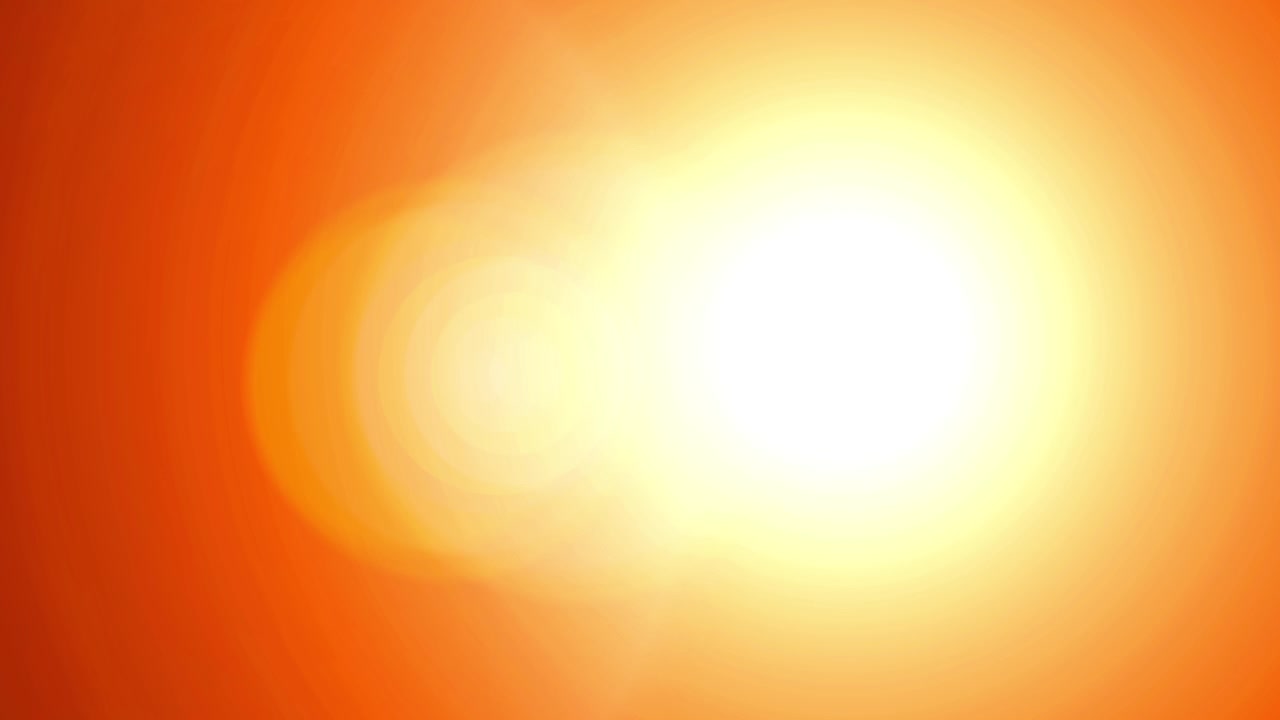 Bright Orange Lens Flare Moving Across Black Background